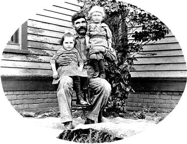 Joseph Vanek with his and Anna's youngest children, Mary and Herman, ca. 1915.