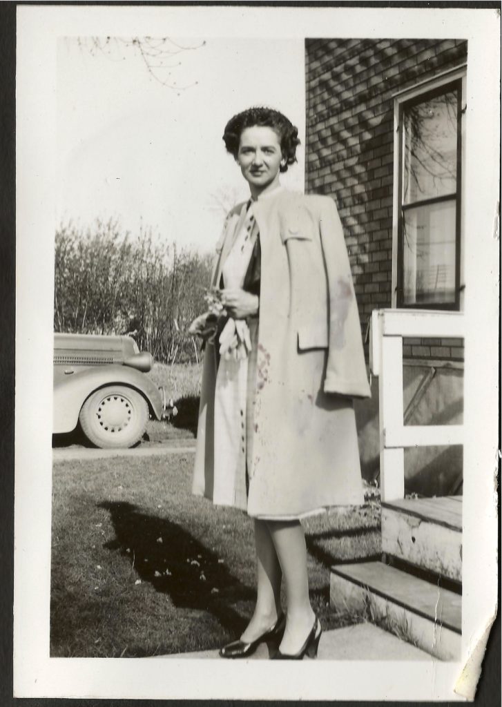 Family photograph of Pauline Shoultz outside home, 1940s.